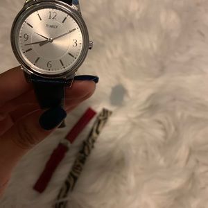 Timex watch with different colored bracelets